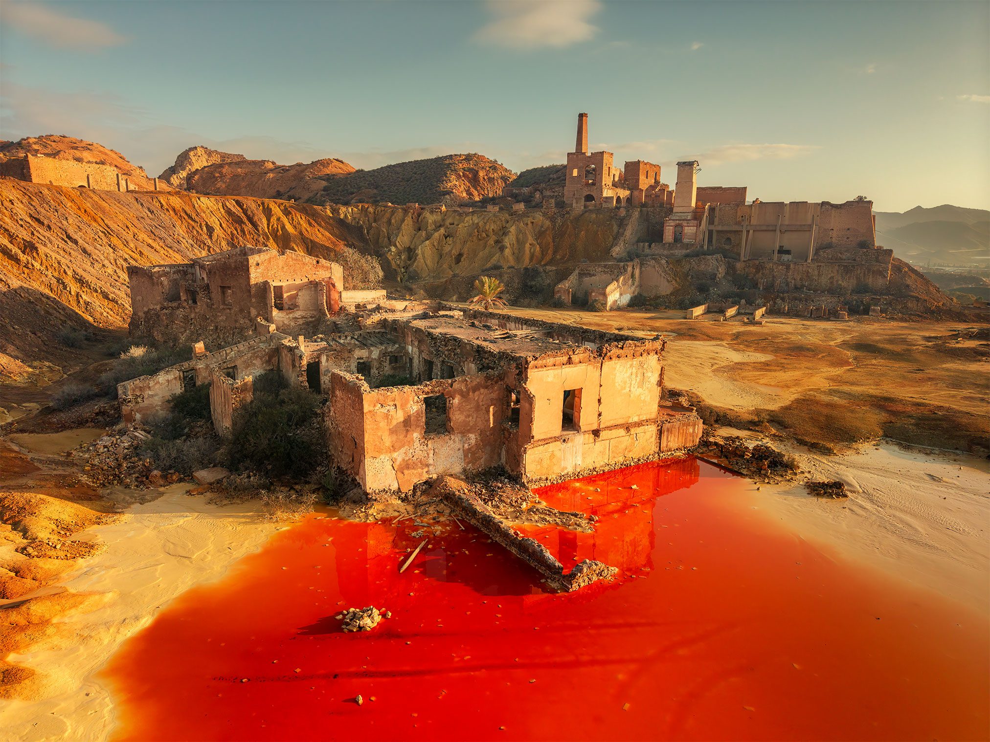 Ruins of a mine with red stained water in southern Spain