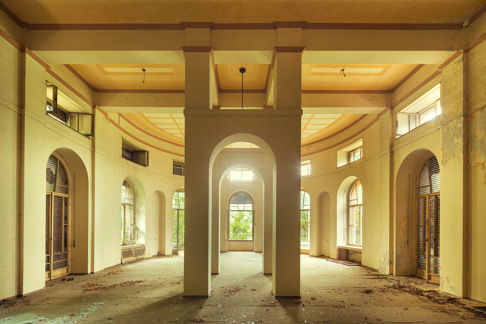 Curved hall with arched windows in a former holiday camp on Lake Maggiore, Italy