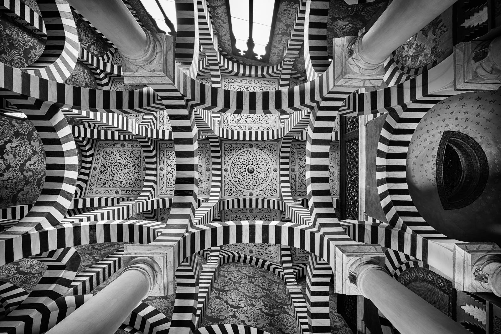 Black-and-white striped horseshoe arches in the chapel of Rocchetta Mattei castle, Emilia-Romagna, Italy