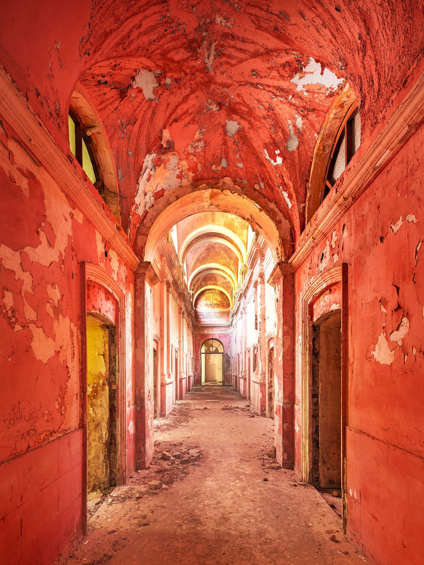 Red vaulted corridor in an abandoned bathhouse in Romania