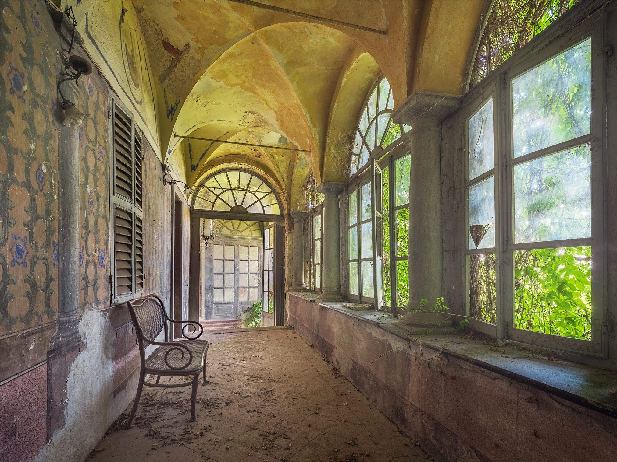 Glazed loggia with a vaulted ceiling in a historic villa in Piedmont, Italy