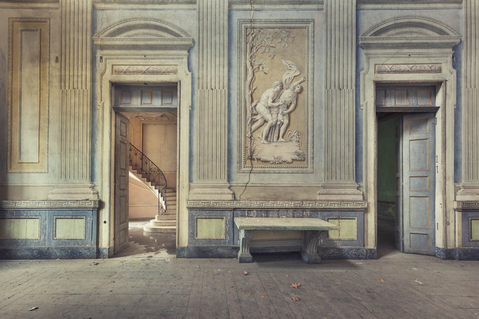 Stucco relief with classical figures between two doors in a villa in Piedmont, Italy