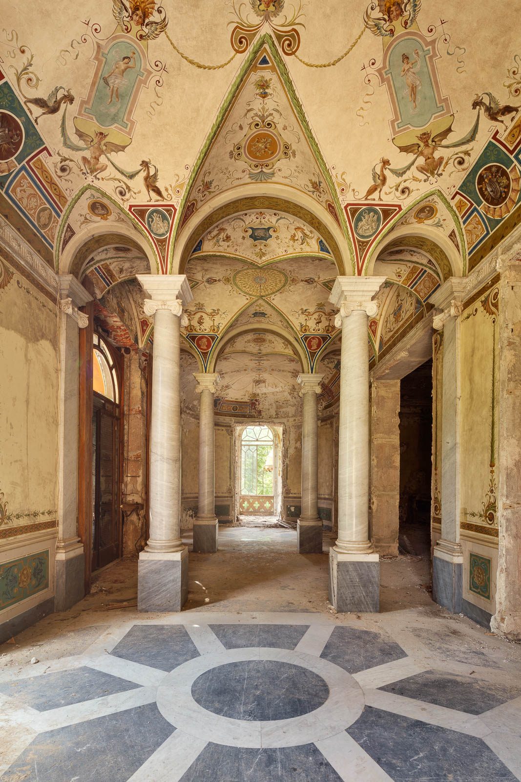 Vaulted ceiling with grotesques and a star-patterned floor in a forgotten villa in Emilia-Romagna, Italy