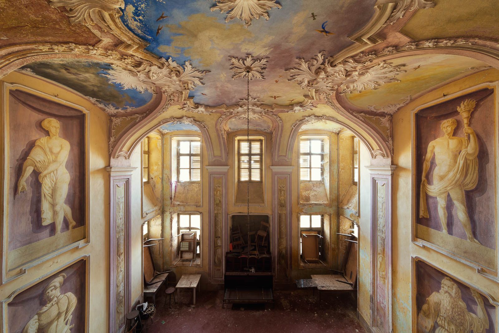 Sky fresco with birds above an abandoned vestibule in a villa in Piedmont, Italy