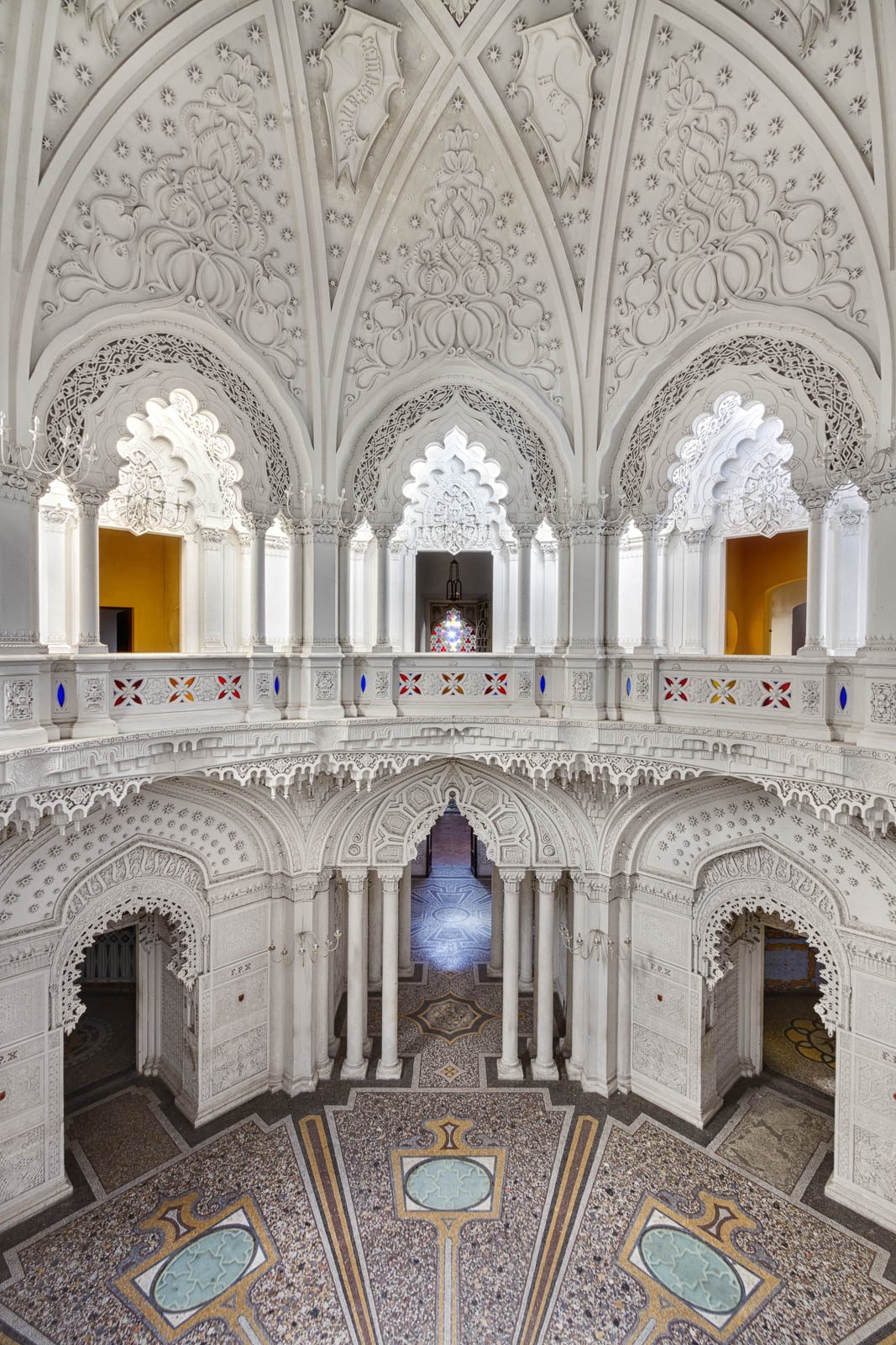 Two-story Moorish-style gallery with a stained-glass window in Castello di Sammezzano, Tuscany, Italy