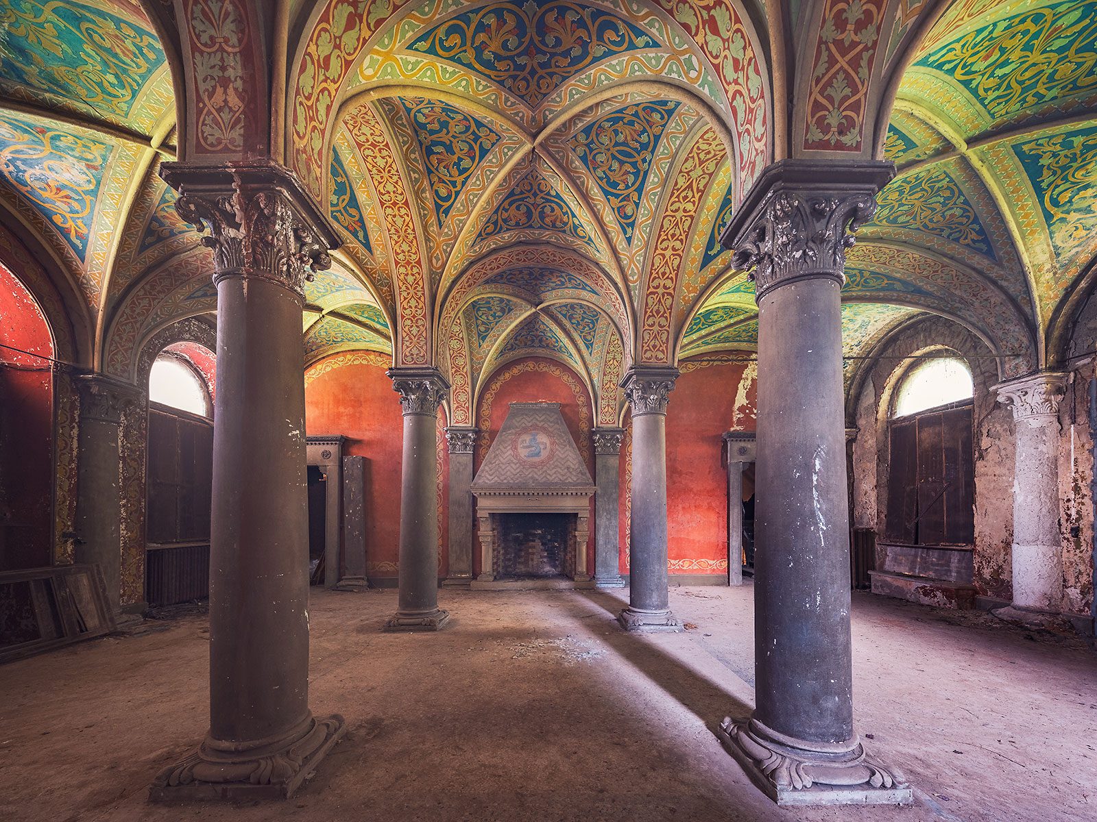 Polychrome-painted cross vault with a fireplace in a palazzo in Piedmont, Italy