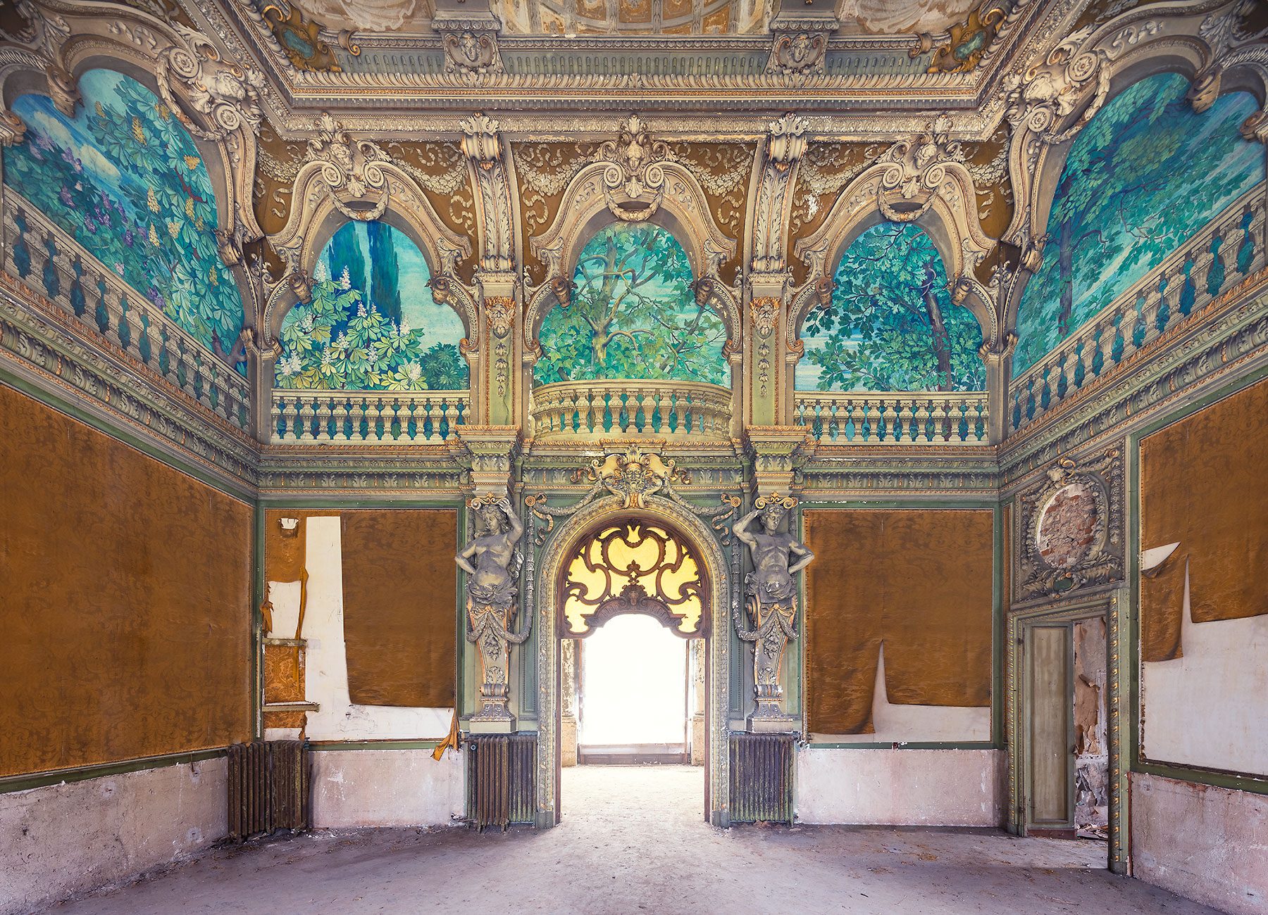 Gilded vestibule with painted panoramas and atlas figures in a villa near Turin, Piedmont, Italy