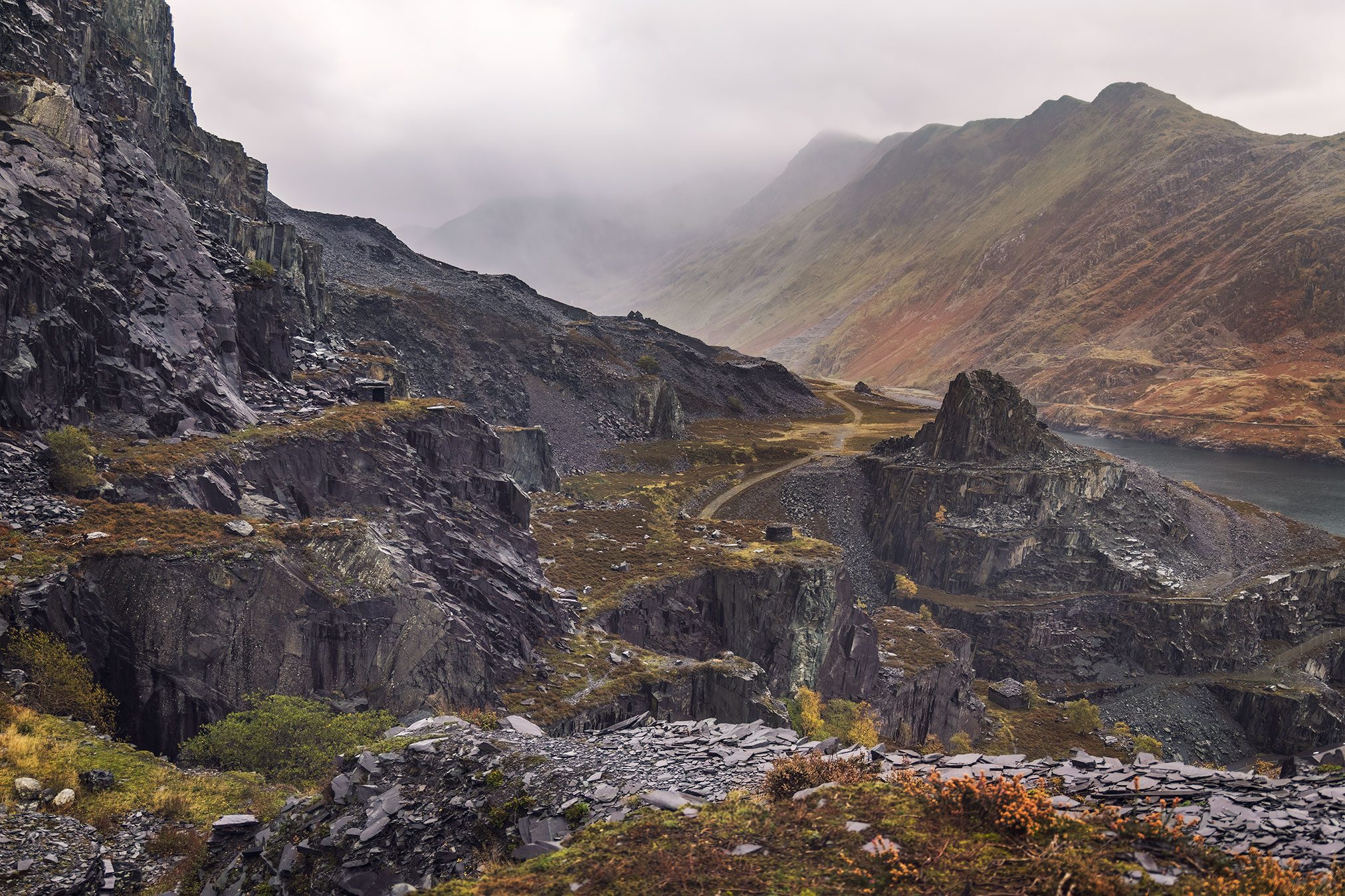 A former slate quarry set against mountains in Wales, United Kingdom