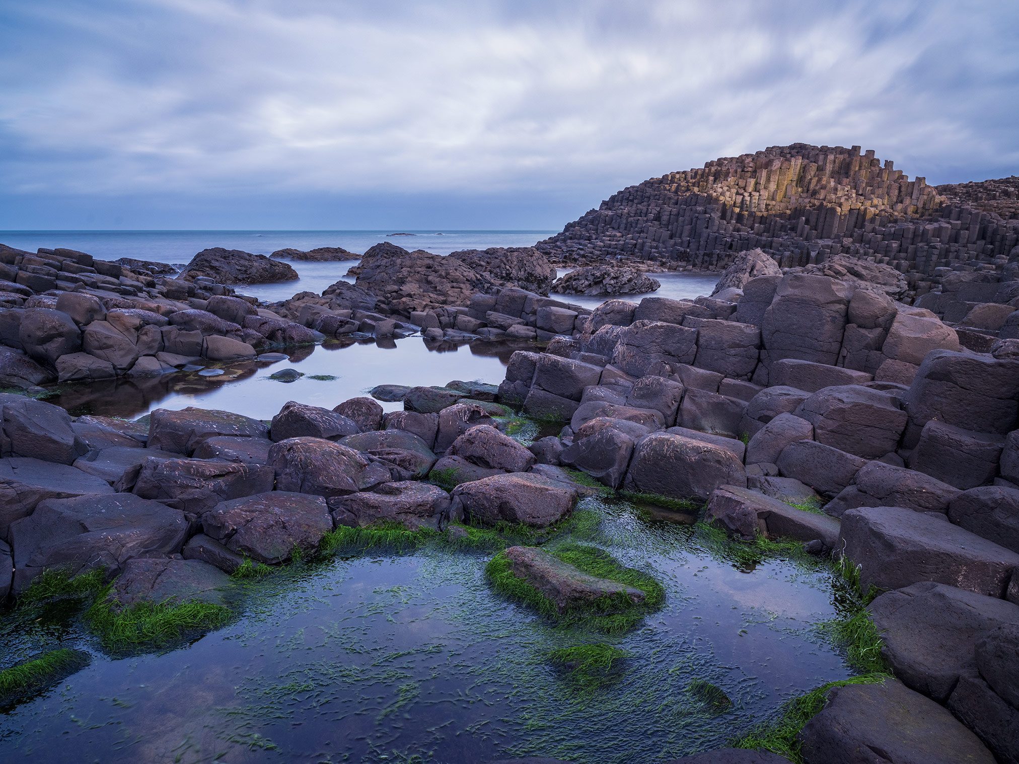 Hexagonal basalt columns by the sea at the Giant's Causeway, Northern Ireland