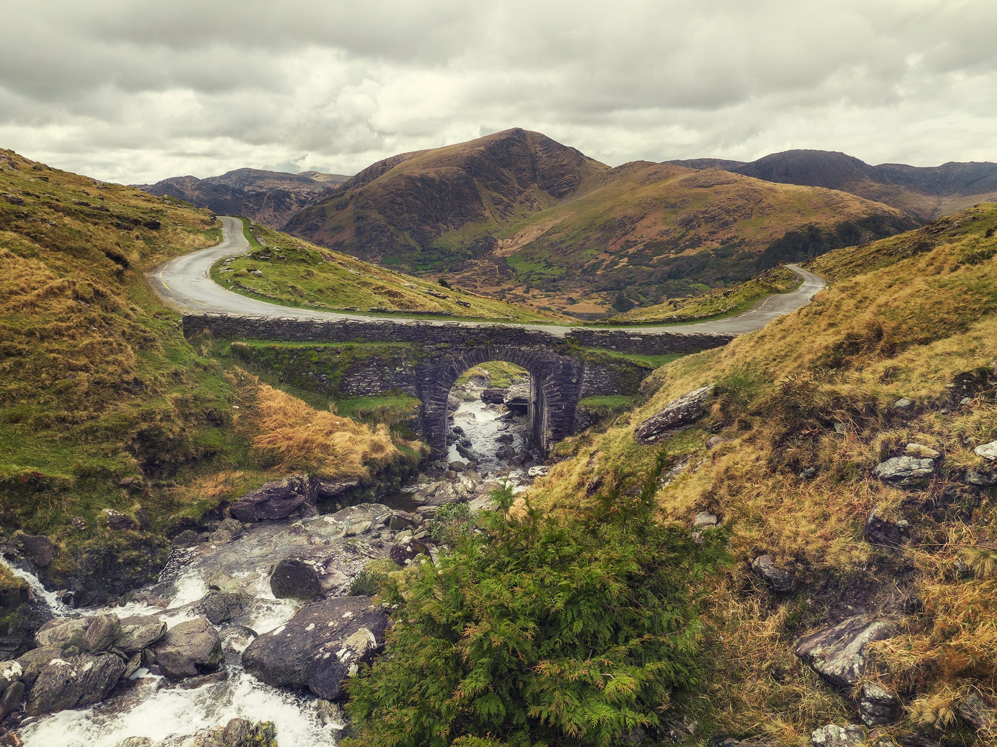 A stone bridge over a mountain stream at the Healy Pass, Ireland