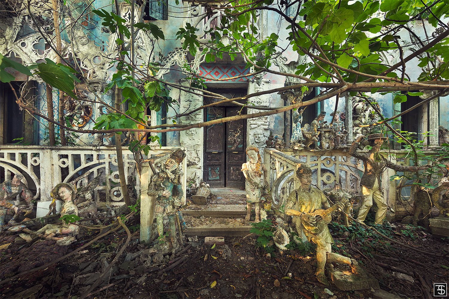 Ensemble of sculptures in front of an abandoned artist's house in Italy
