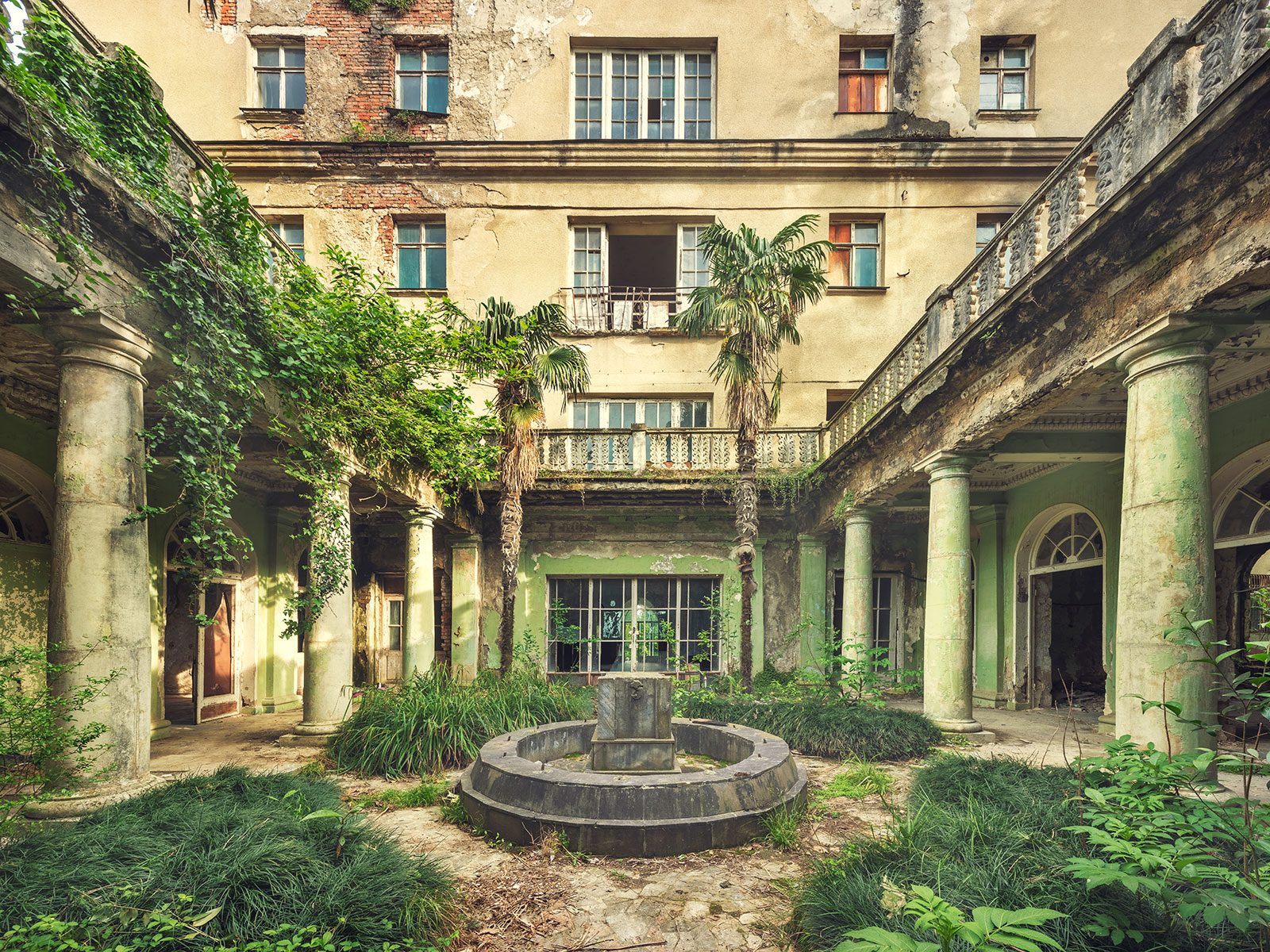 Courtyard with colonnade and fountain of a sanatorium in Georgia
