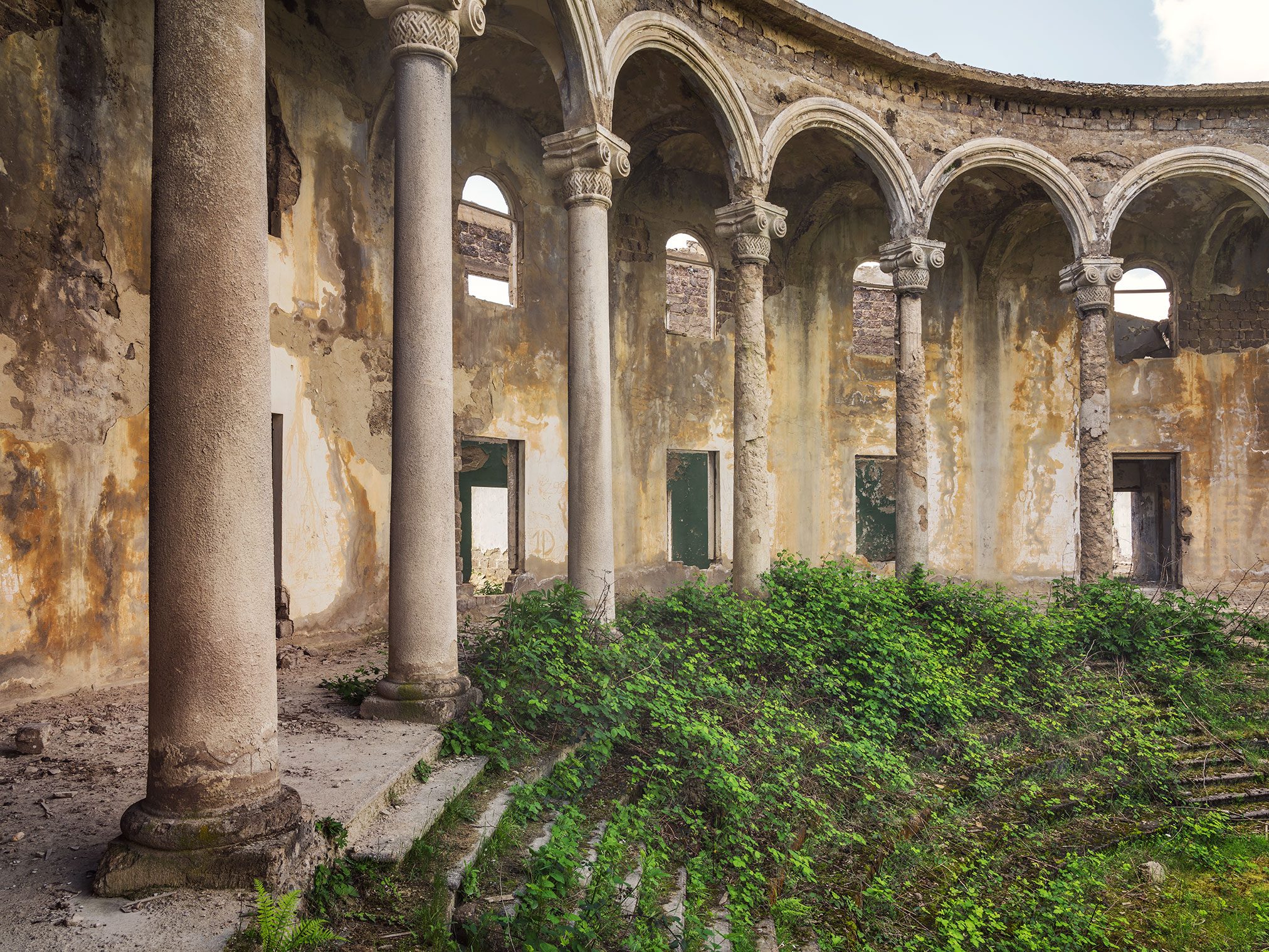 Curved colonnade of a former culture house in Georgia