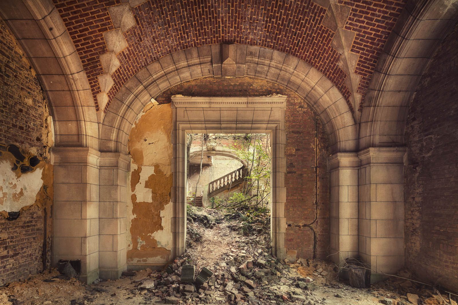 Vaulted corridor with a view of a staircase in a château in Belgium