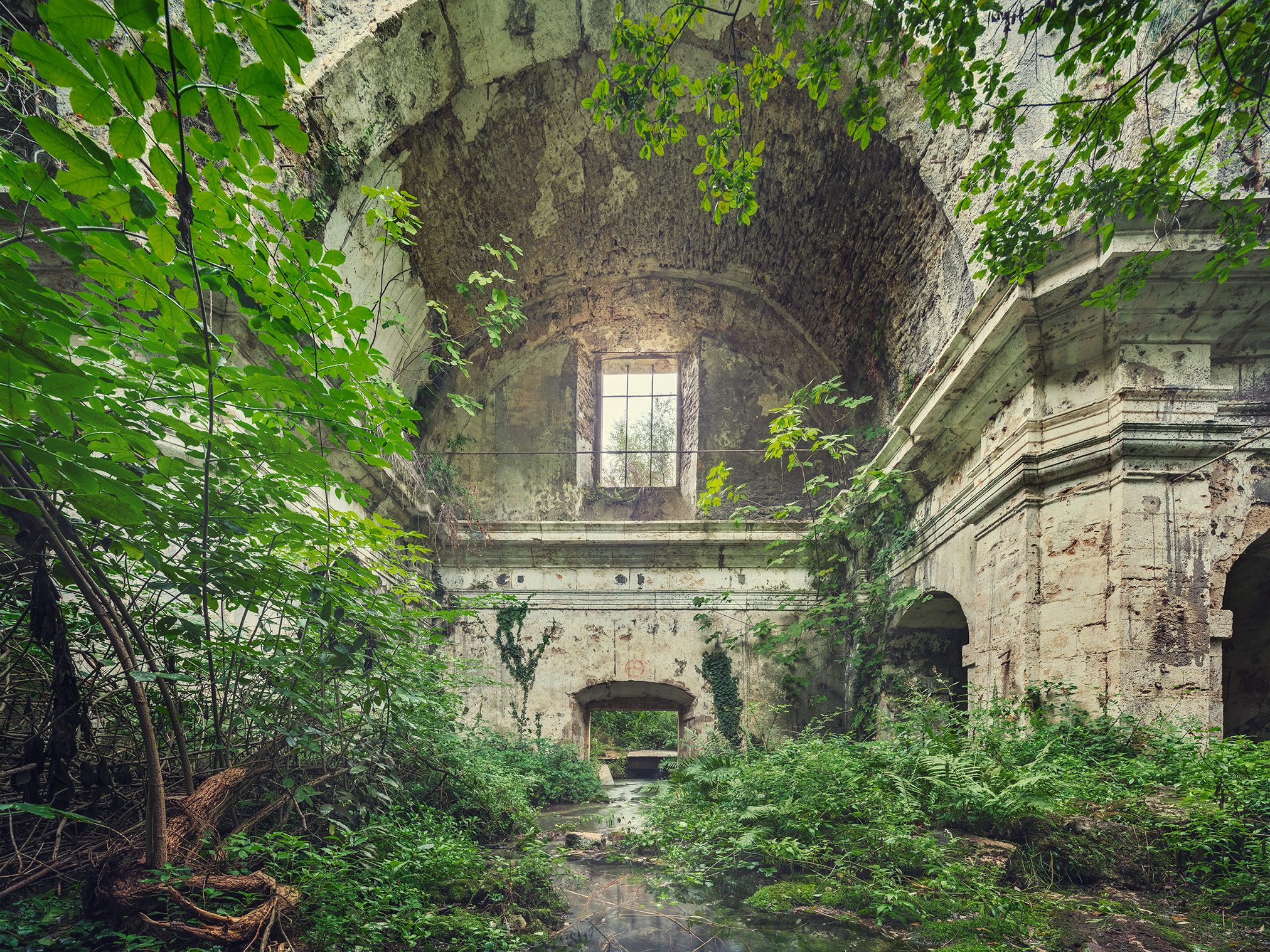 Flooded church ruin with vaulted ceiling in Italy