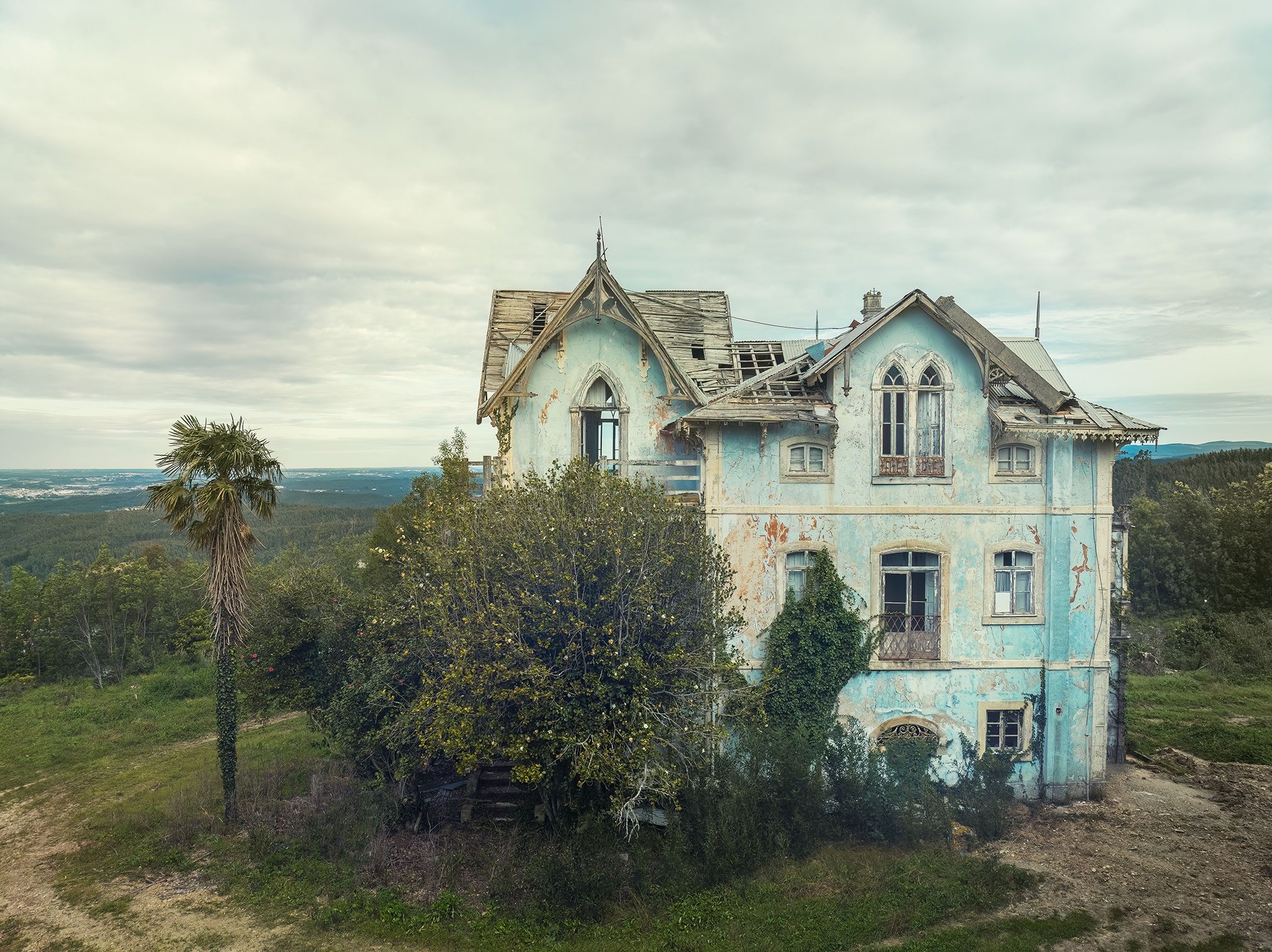 Pale blue Victorian villa with pointed gables in Portugal