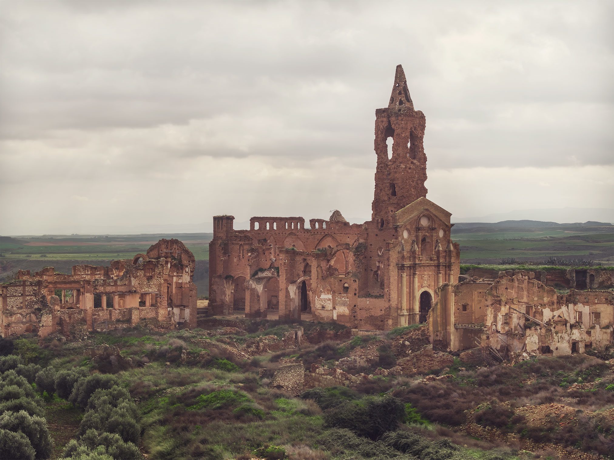 Ruined village with church tower in Spain