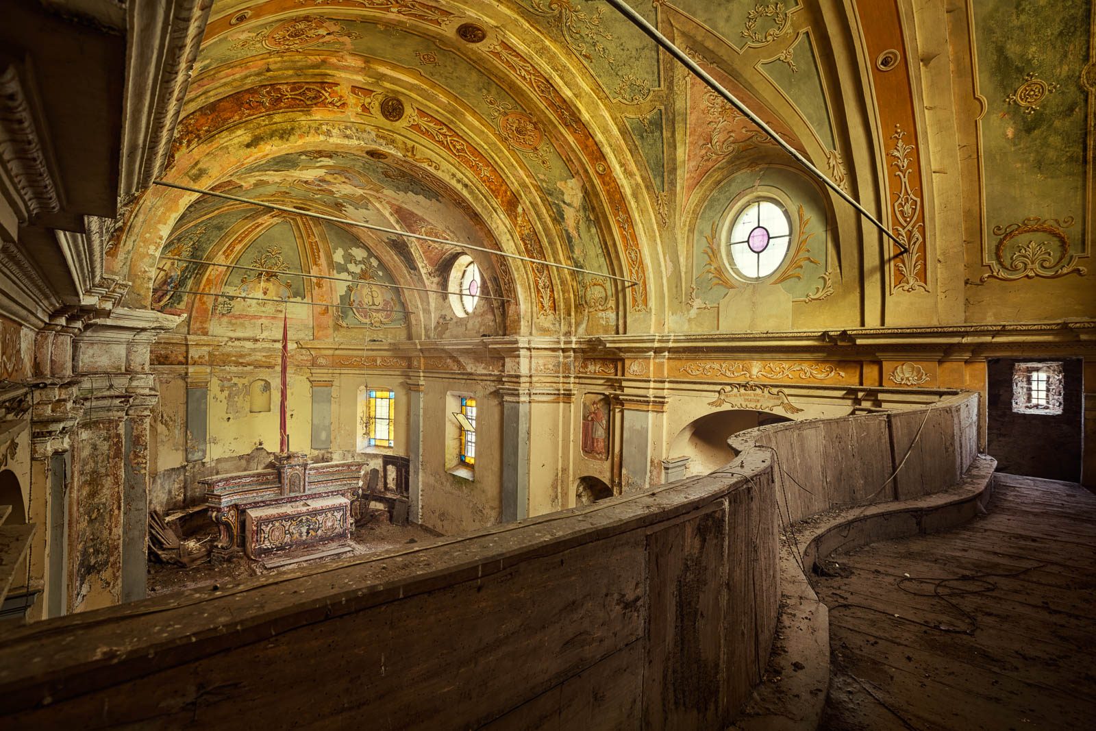 Abandoned church with floral ceiling painting in Italy