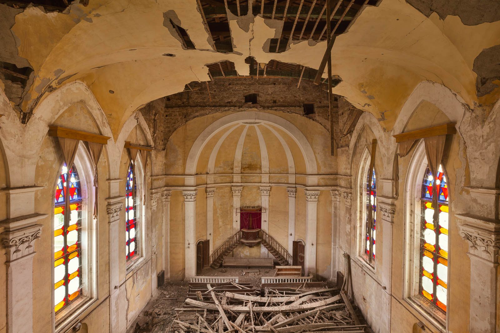 Abandoned church with a collapsed roof in Italy