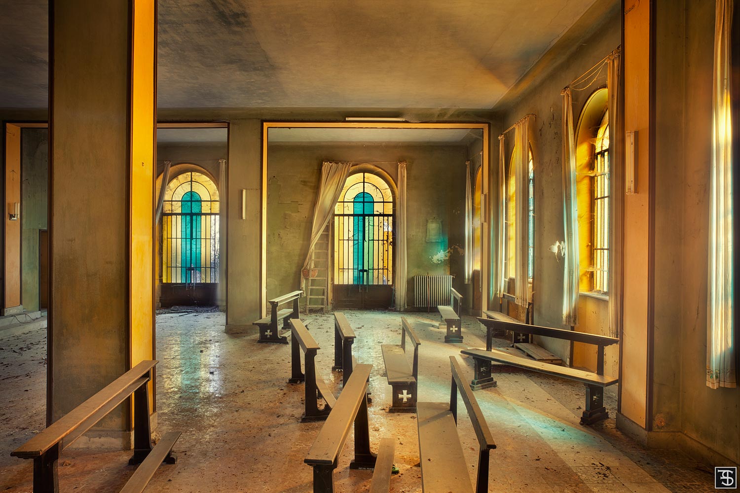 Abandoned chapel with turquoise windows in Italy