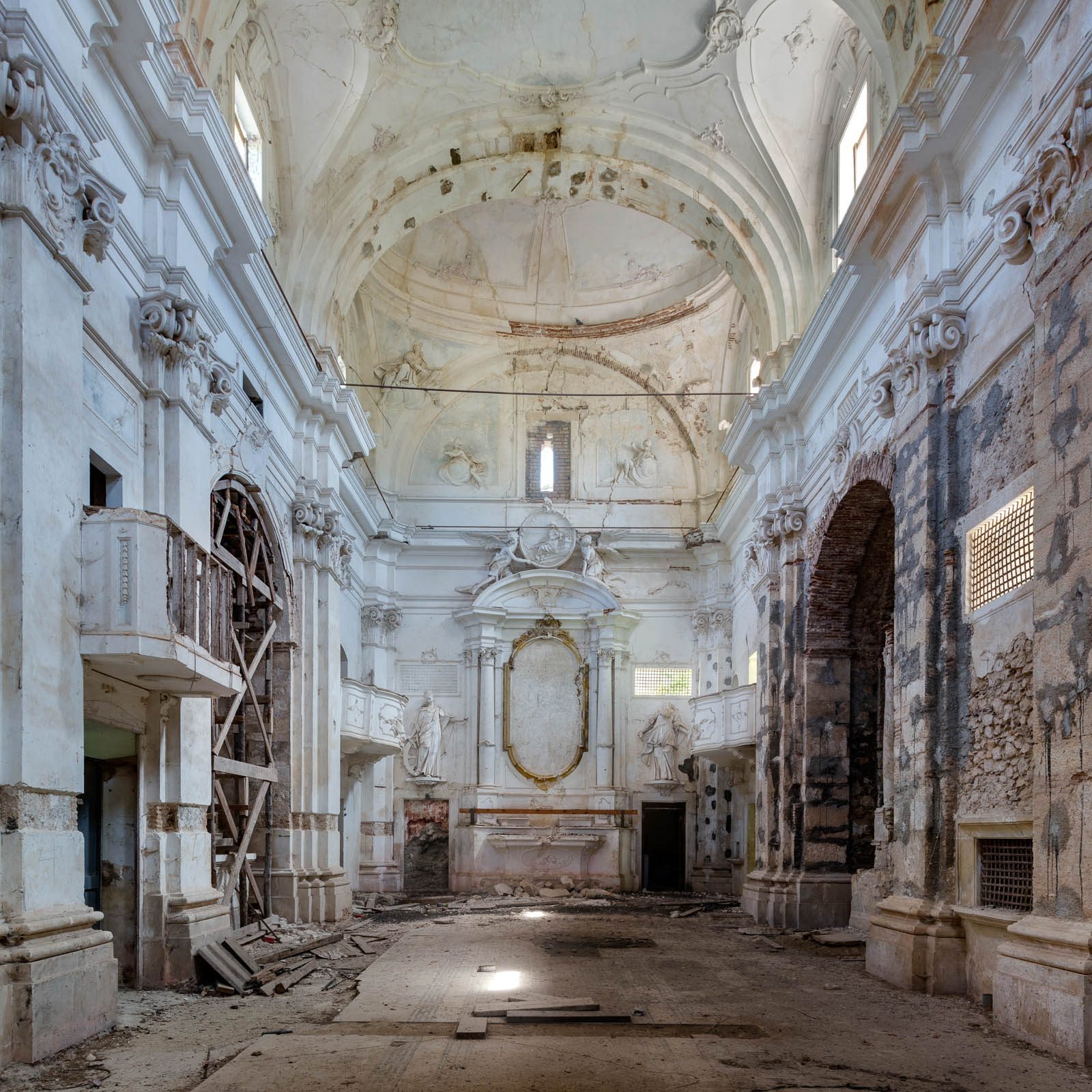White baroque church with damaged dome in an earthquake affected area in Italy
