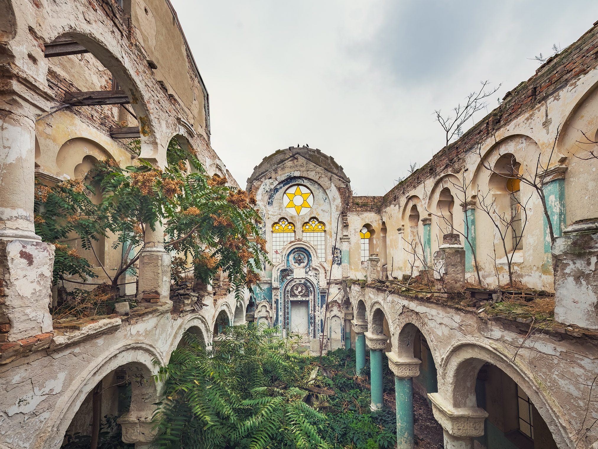 Abandoned synagogue with Star of David window in Romania
