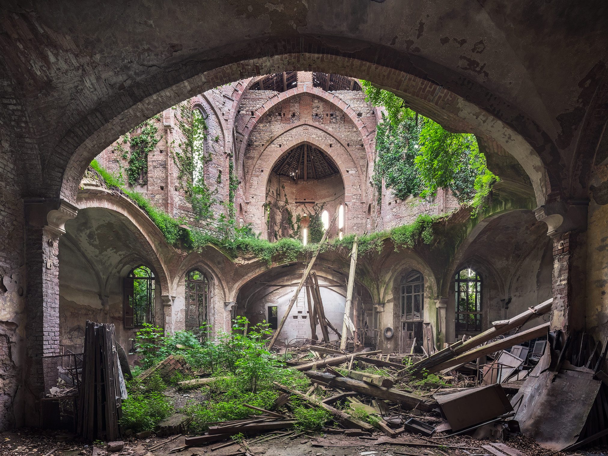 Collapsed church overgrown with ivy in Italy
