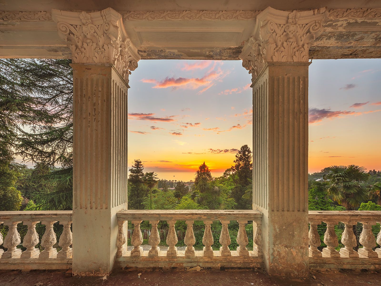 Balcony with columns and a sea view at sunset, Georgia