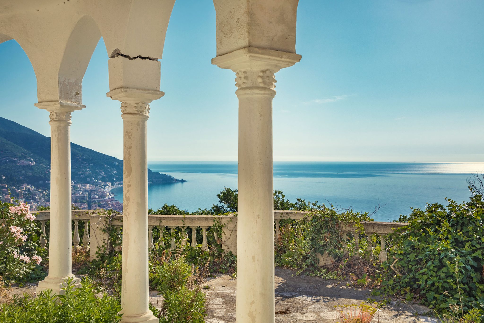 Loggia with arches overlooking the coast in Italy