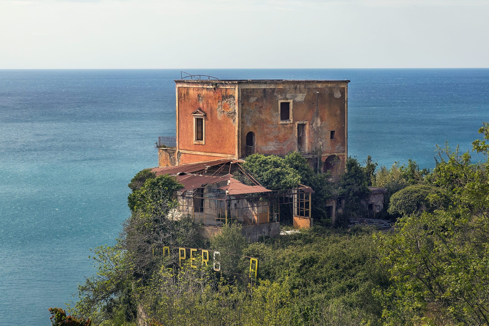 Abandoned villa with a glass veranda above the sea on the Amalfi coast, Italy