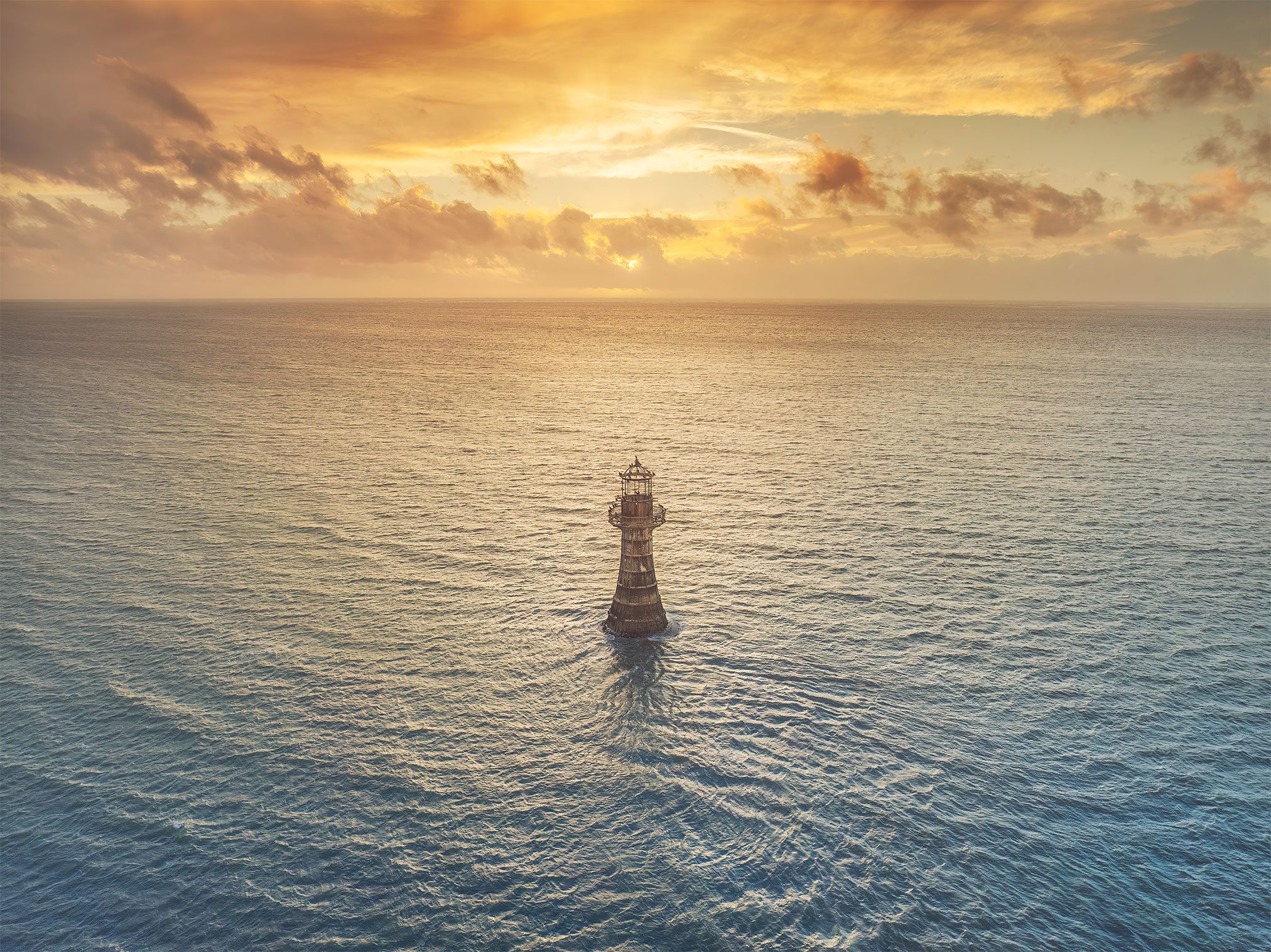 Solitary cast iron lighthouse in the sea, Wales