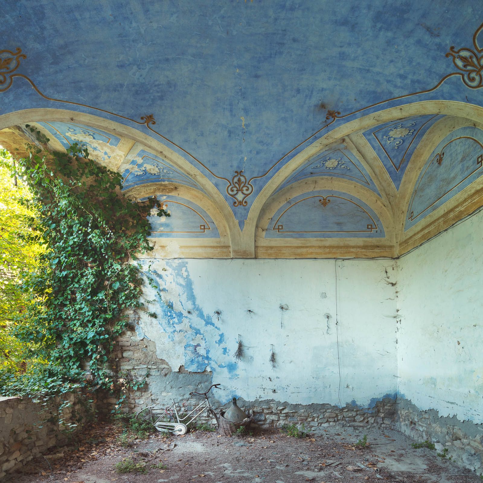 Blue-painted vaulted ceiling on a balcony of an old castello in Emilia-Romagna, Italy