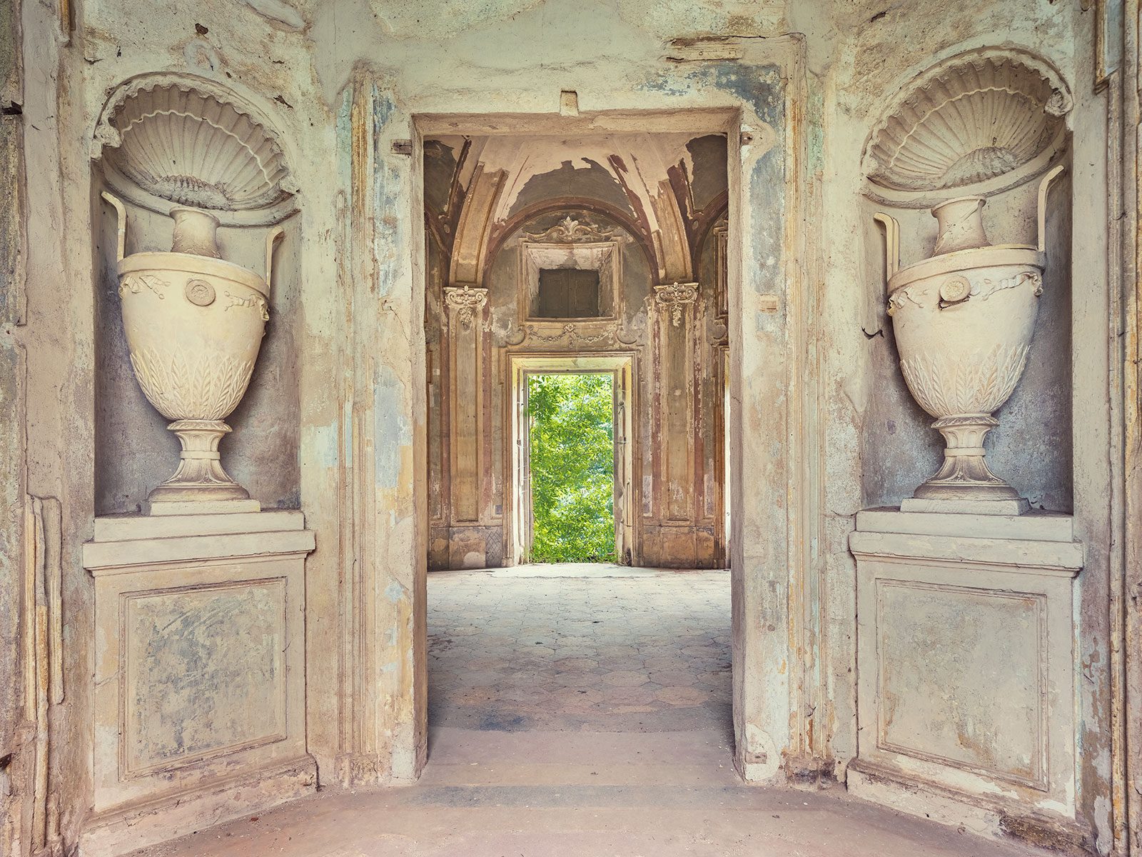 Symmetrical niche with marble urns in the forgotten Villa del Maggiordomo near Turin, Italy