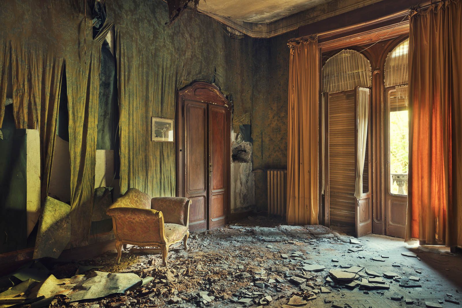 Tattered curtains in an abandoned Art Nouveau villa near Bergamo, Italy