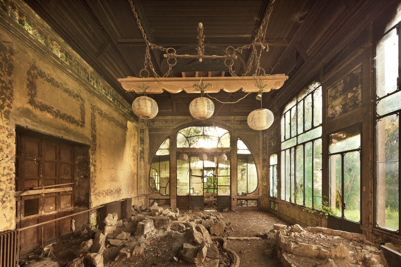 Hall with a glazed veranda in a forgotten Art Nouveau building in Lombardy, Italy