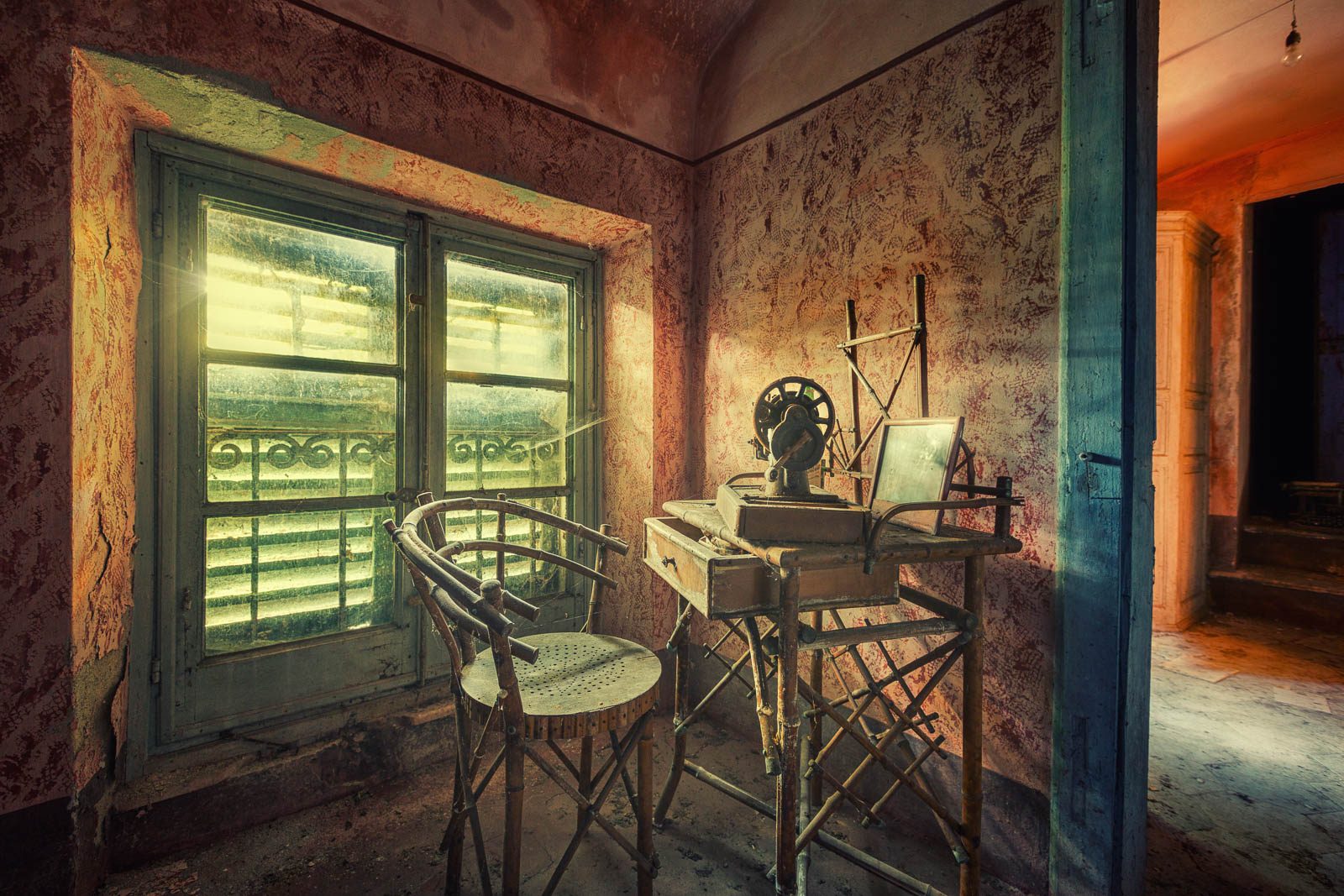 Old sewing machine by the window in a historic villa in Tuscany