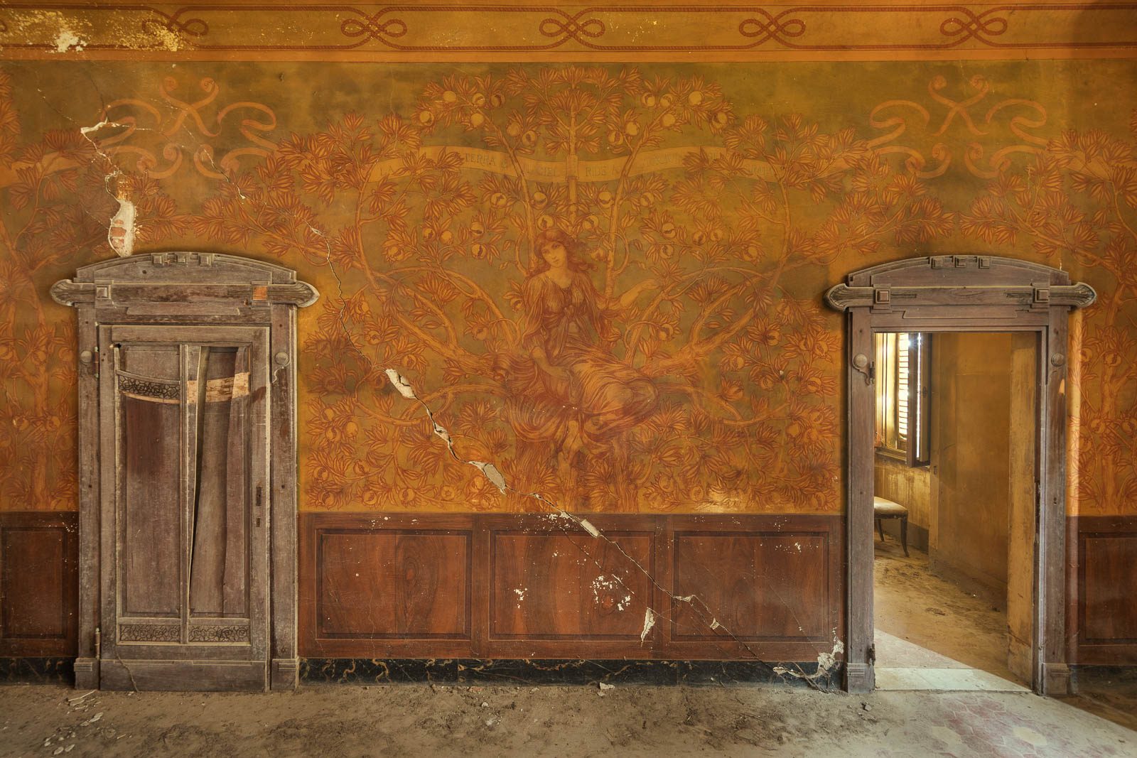 Art Nouveau wall painting with a female figure in a forgotten villa in Tuscany