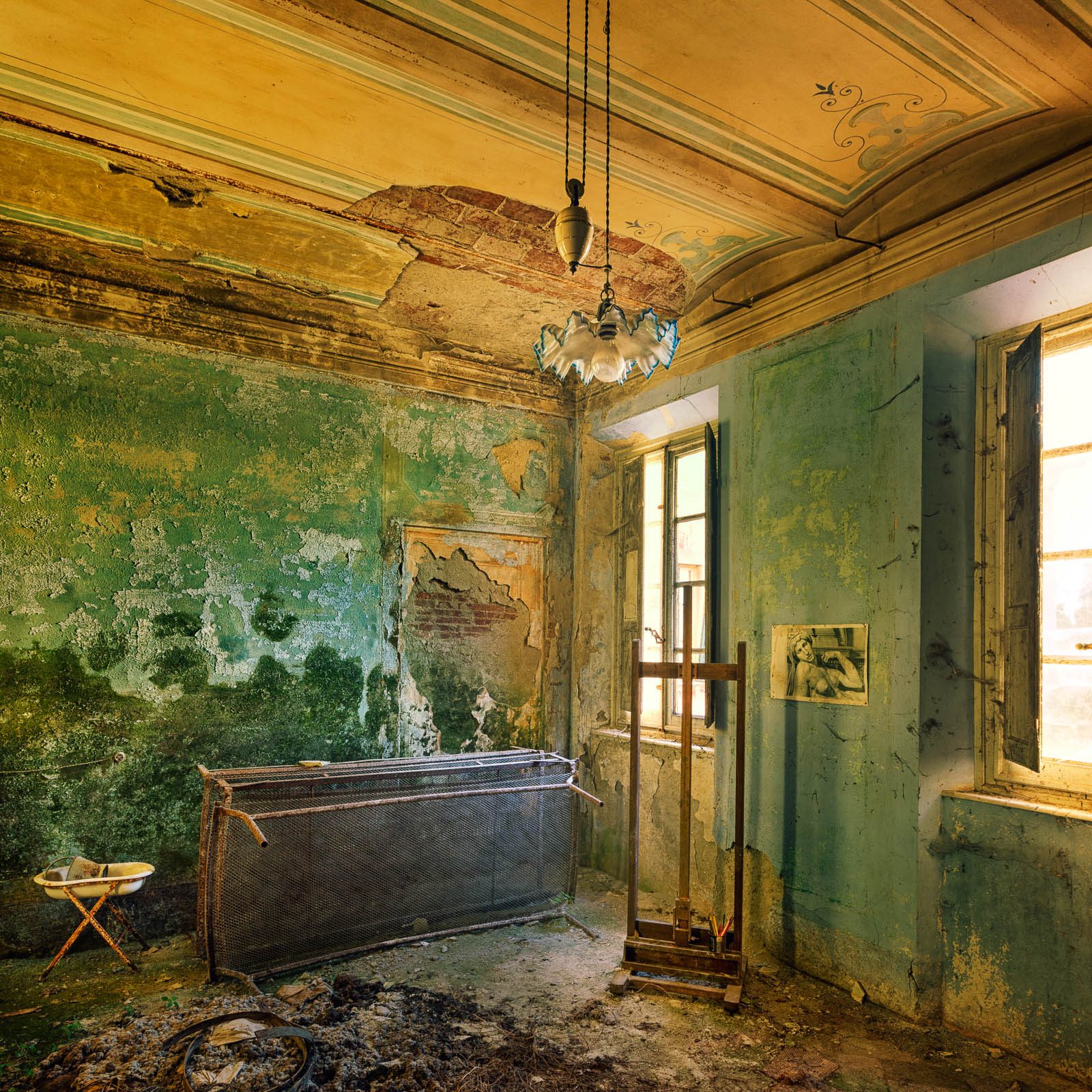 Decayed room with a glass lamp in a forgotten villa in Tuscany