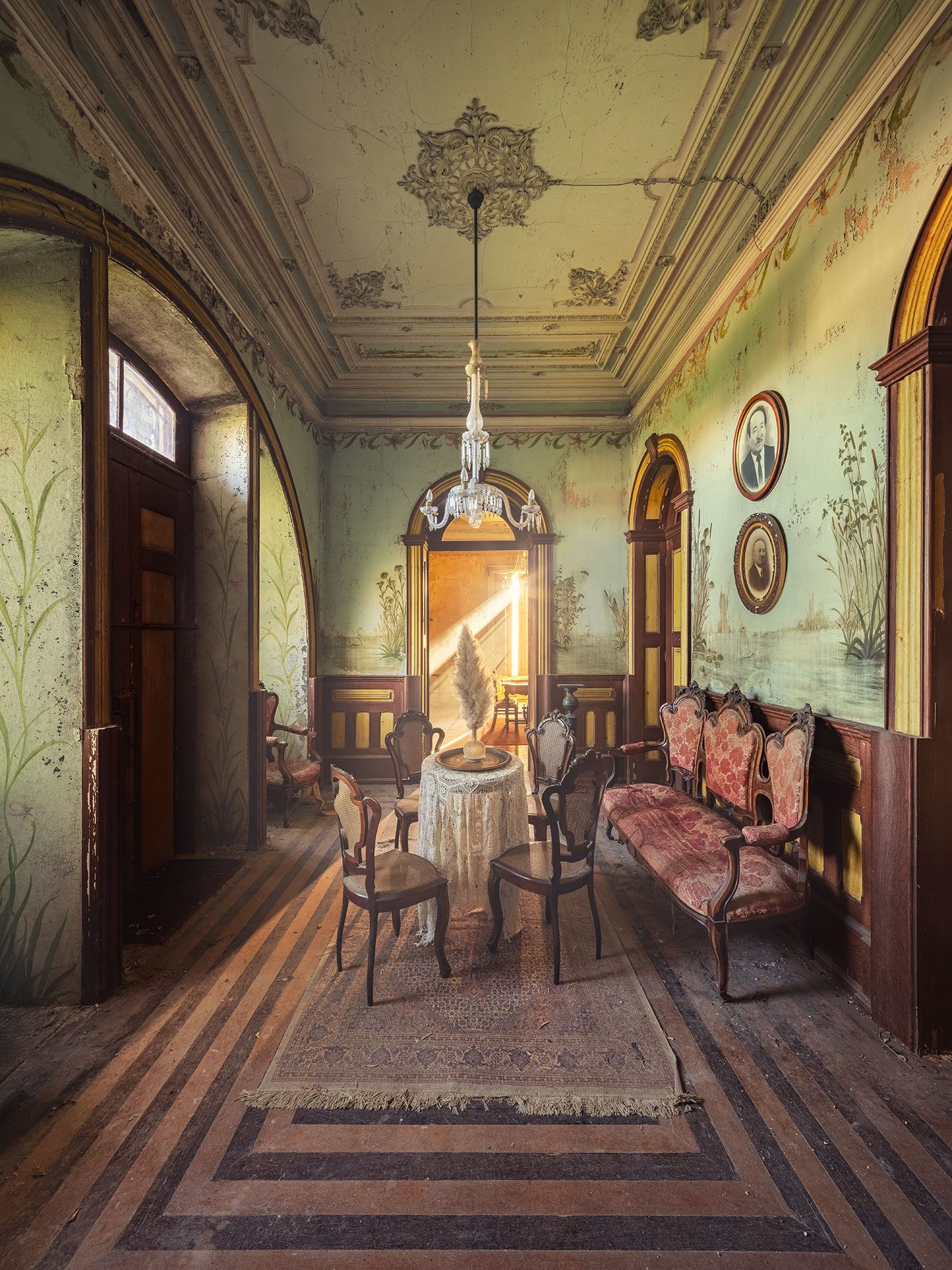 Entrance hall with a seating group in an old Art Nouveau villa in Portugal