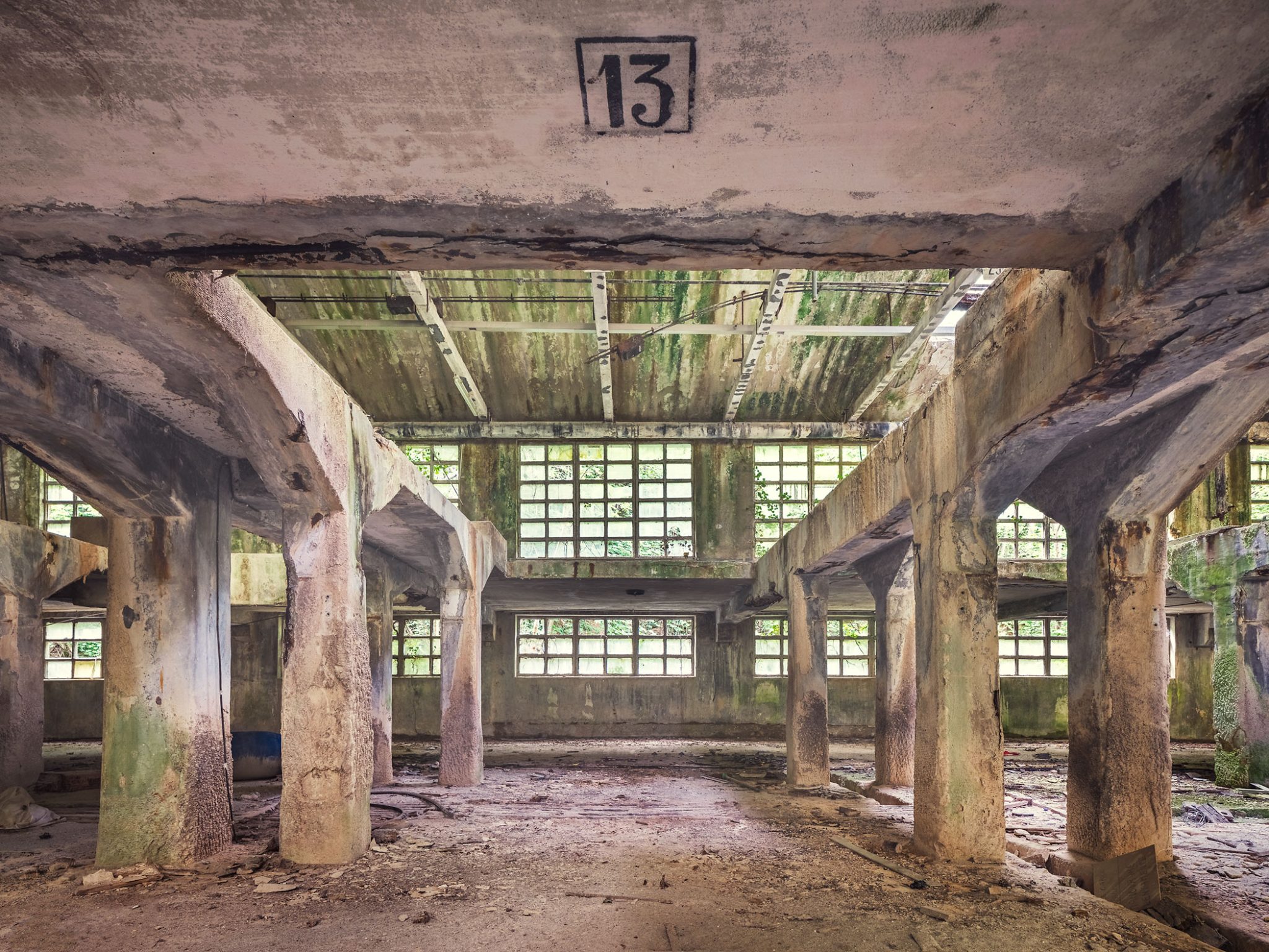 Hall with the number 13 on the ceiling in an old leather factory in Italy