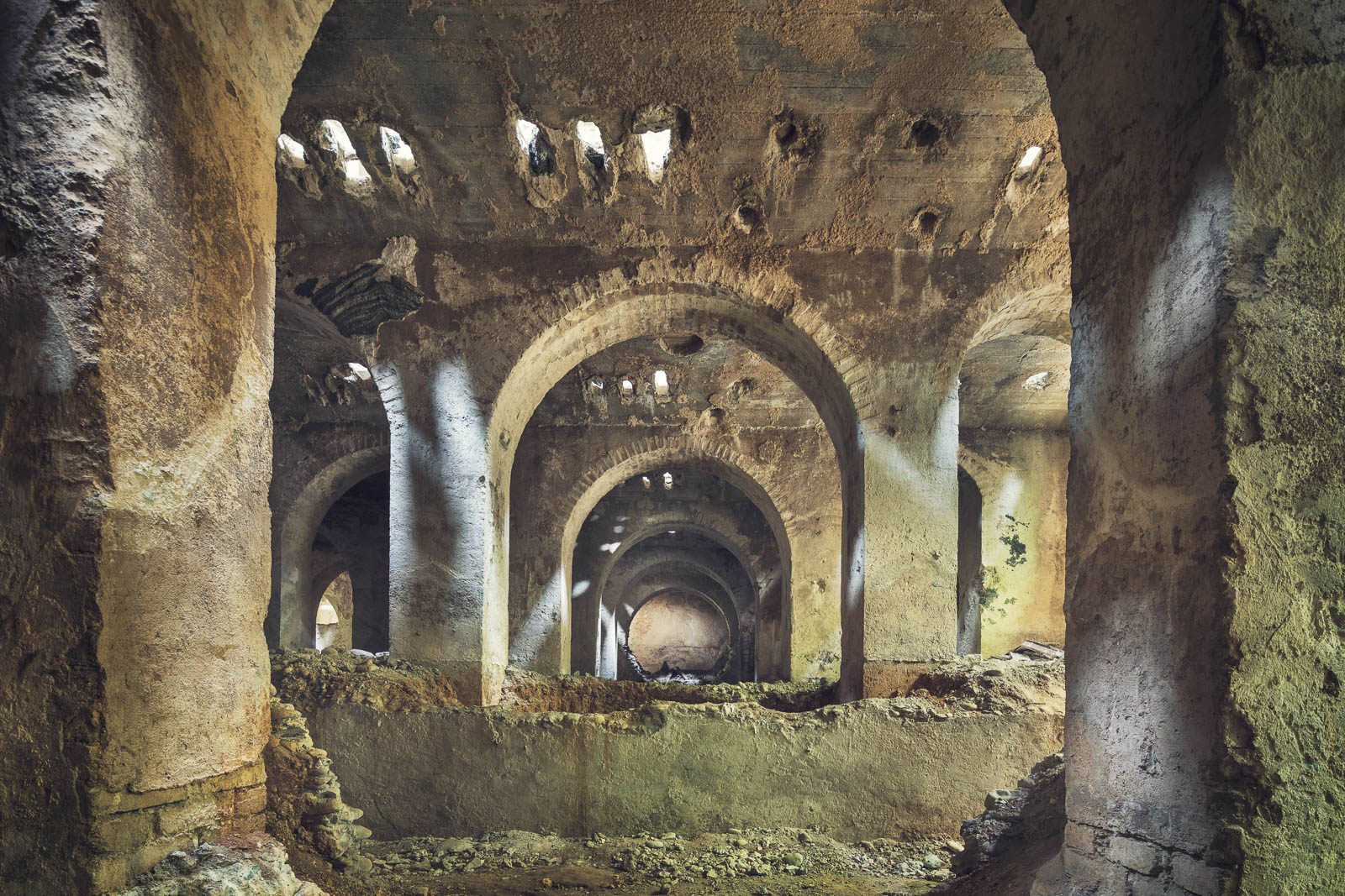 Underground brick vault in the basement of an old cement works in Italy