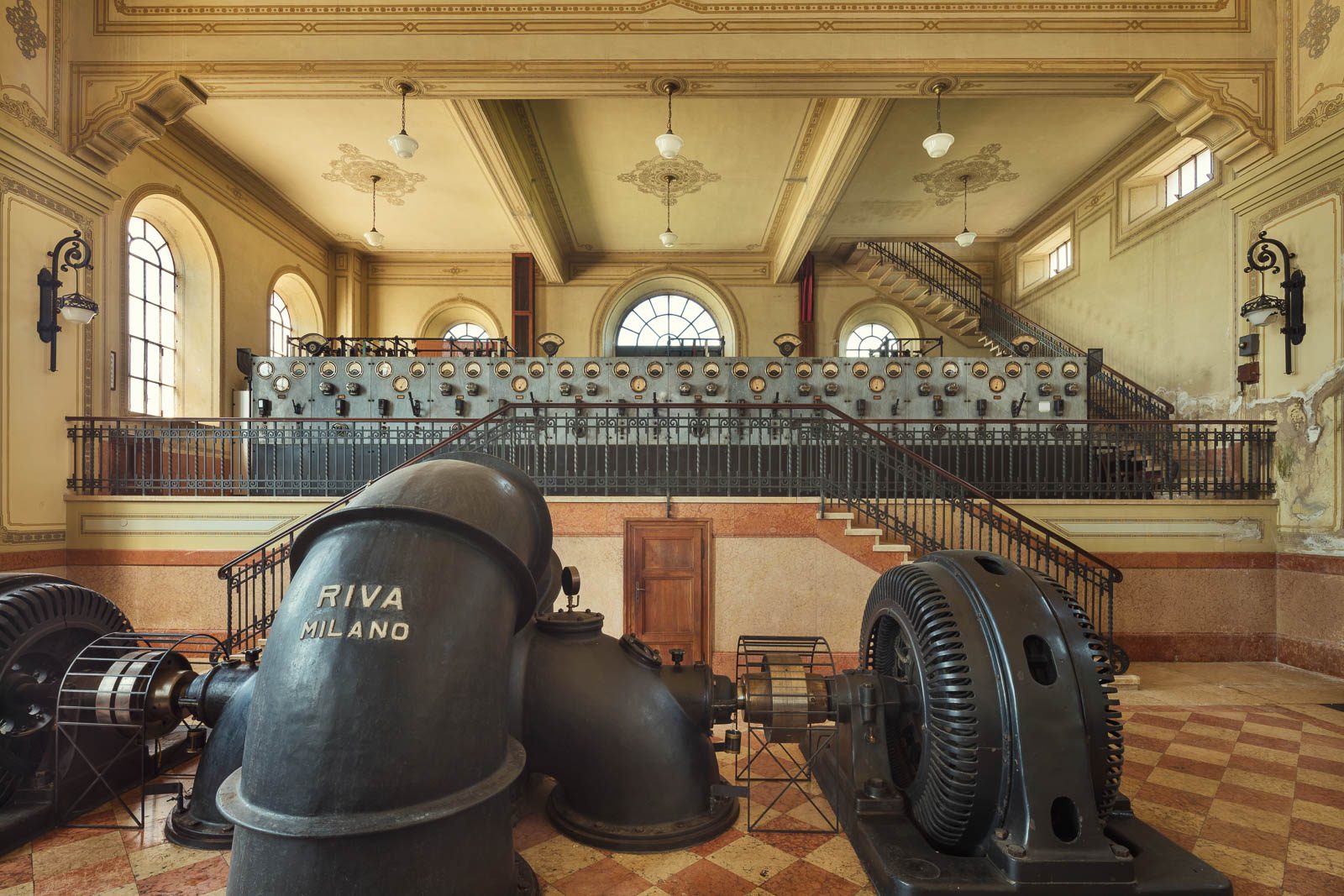 Historic turbine with a maker's plate in an old pumping station in Italy