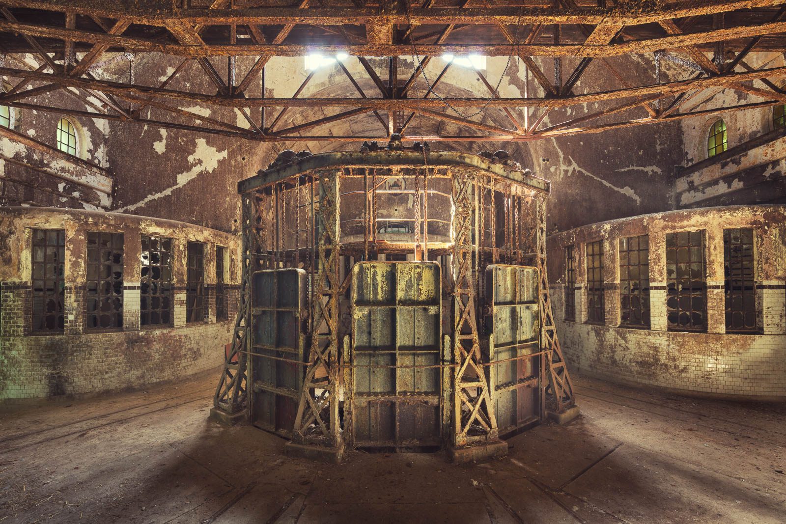 Octagonal cage structure in a round hall of a historic water treatment plant in Germany