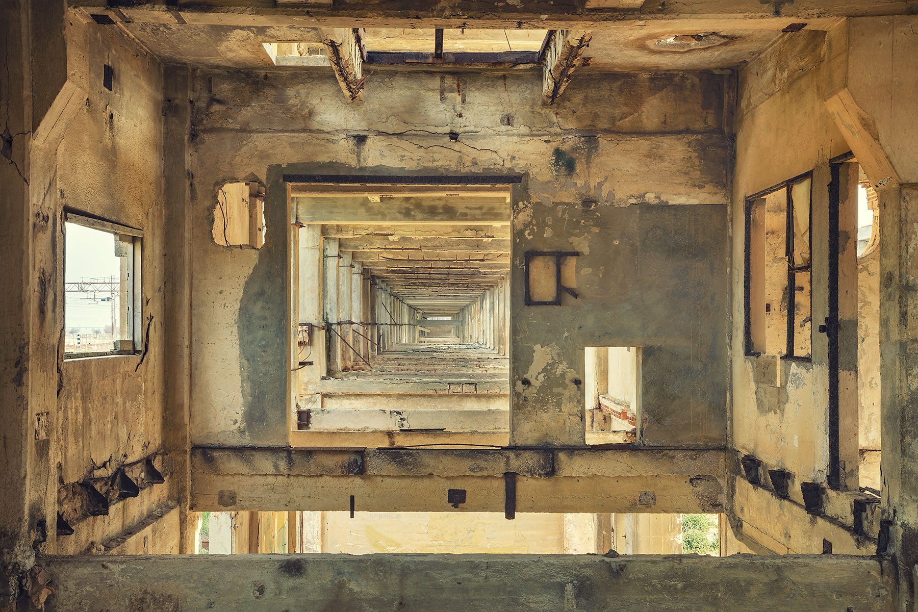 Nested window openings in a large industrial ruin on the Adriatic coast in Italy