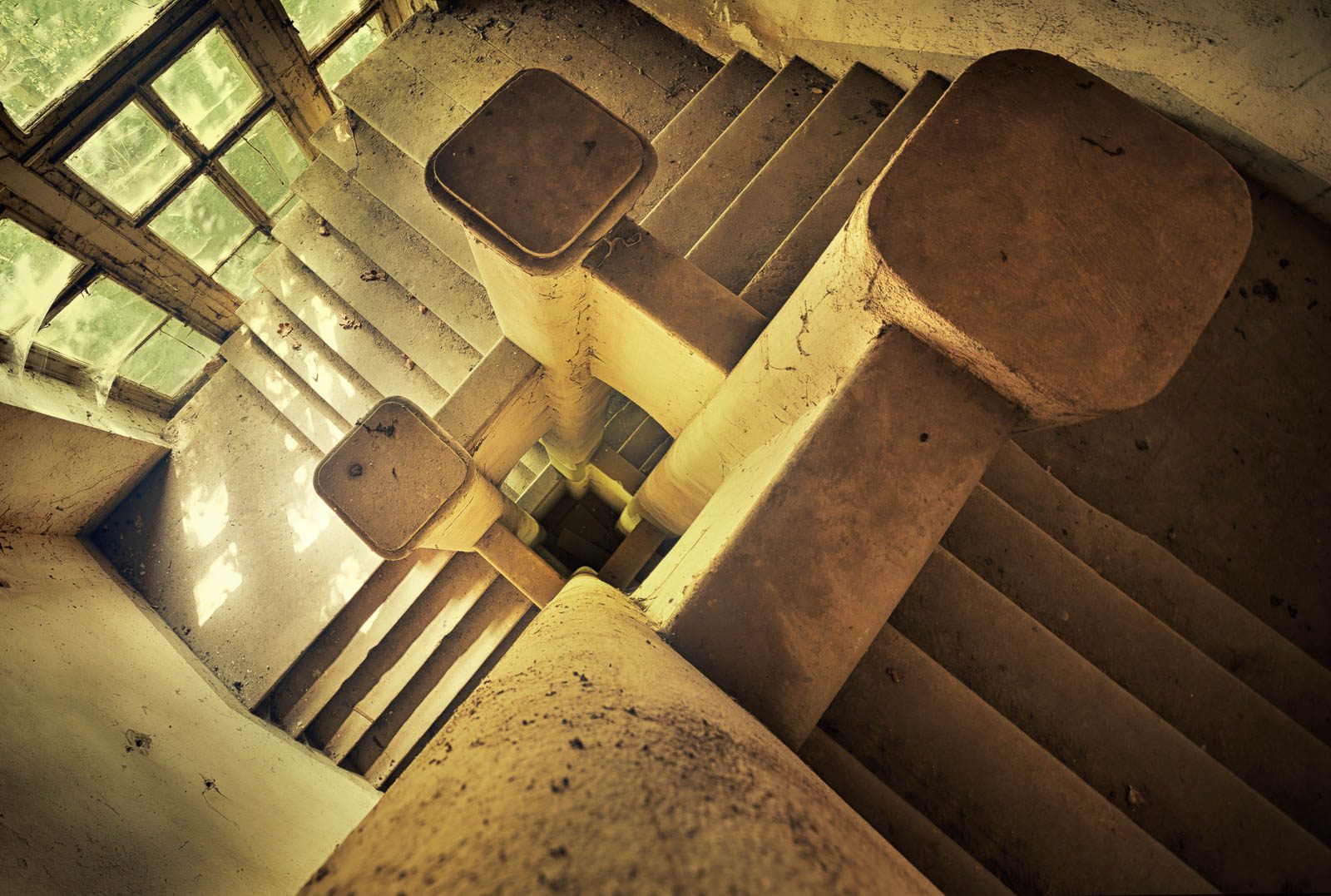 View down into a square staircase in an old castle in Germany