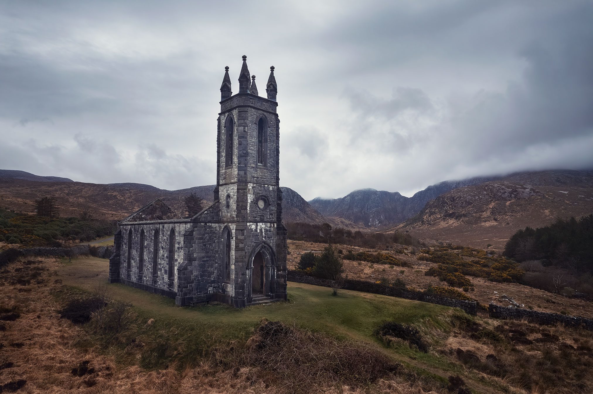 Church ruin with a tower and pinnacles on moorland, Ireland
