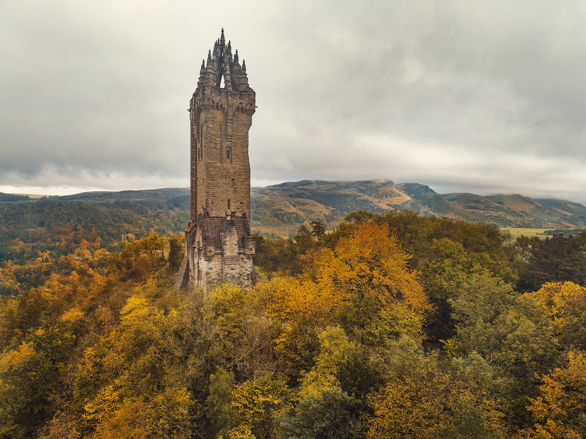 Gothic tower with a crown of turrets on a hilltop, Scotland