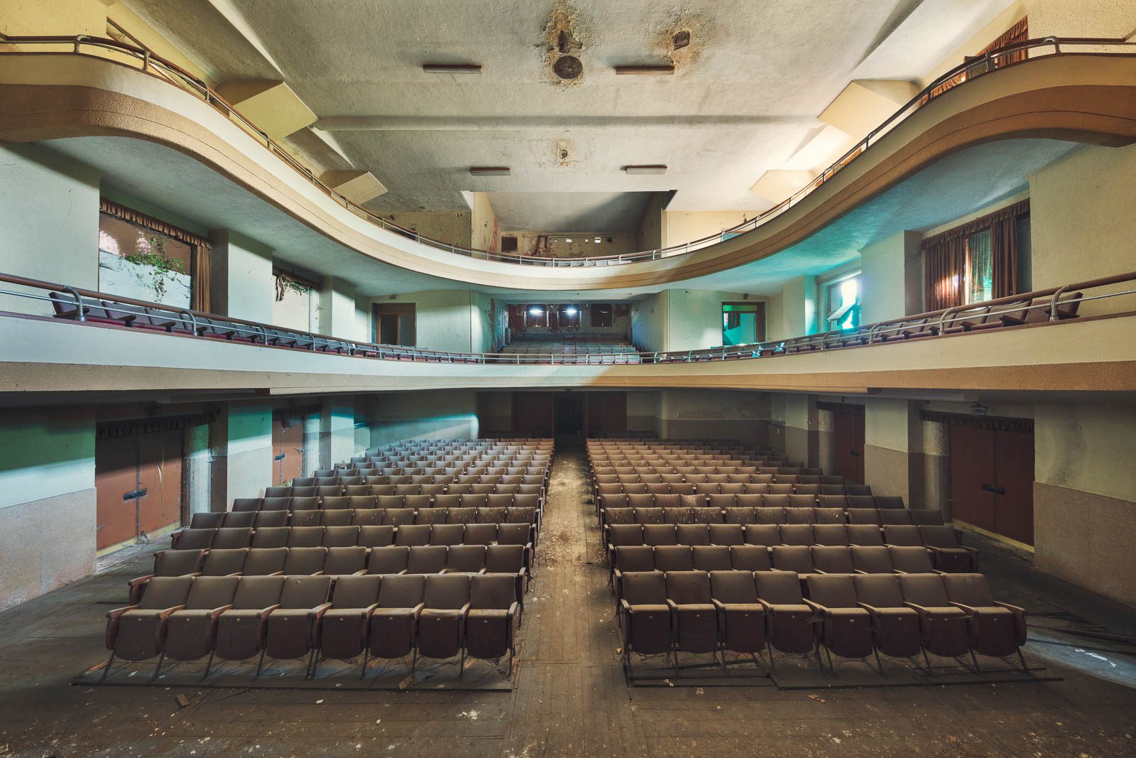 Theatre hall with wave-shaped balconies and rows of seats in Italy