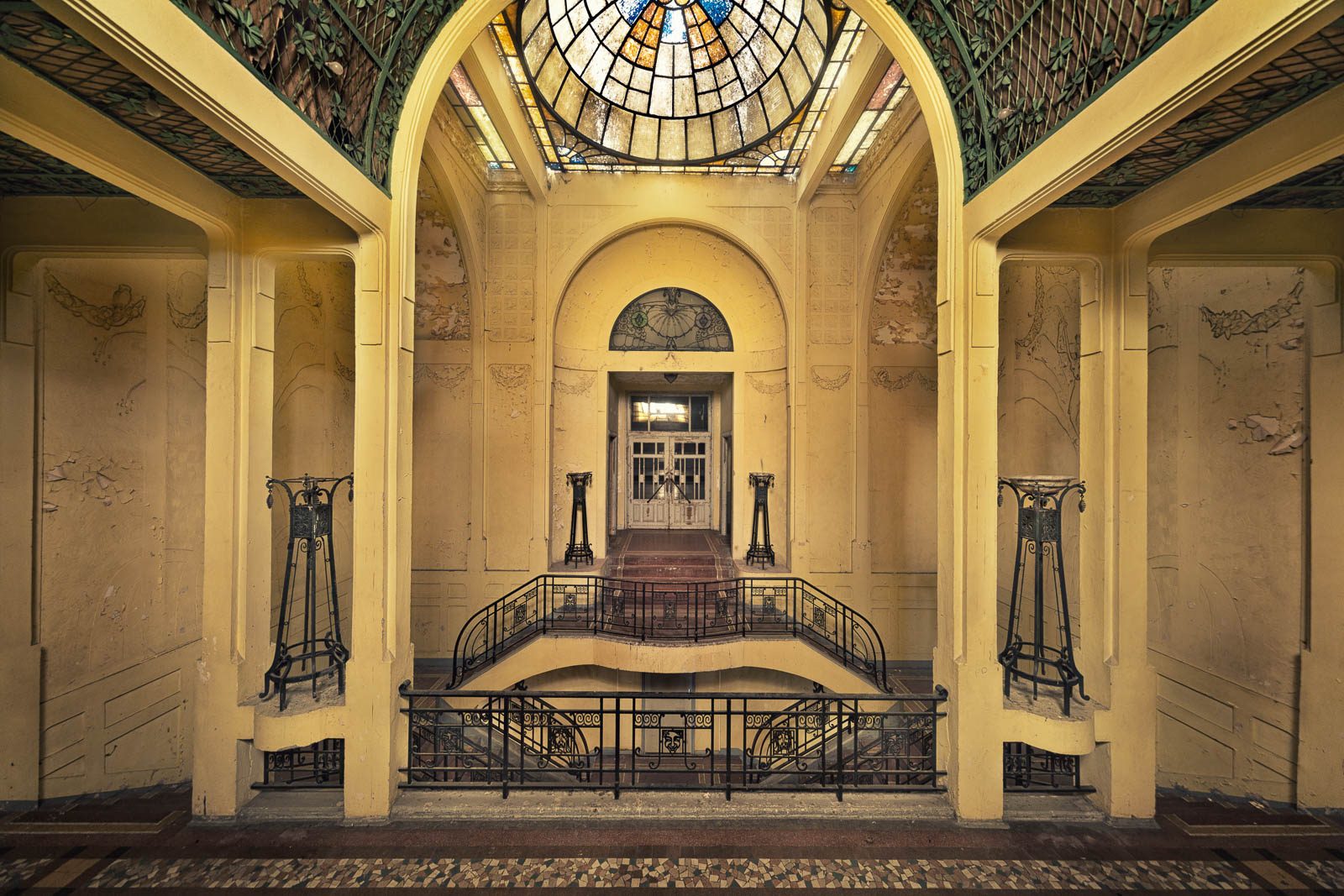 Foyer with a glass dome and curved staircase in an Art Deco dance hall in France