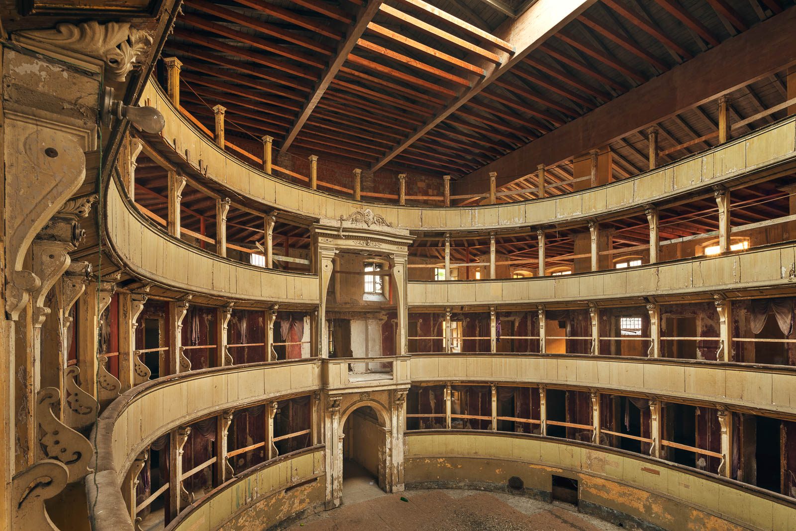Multi-tiered theatre hall with an open roof structure and curved balconies at Lake Garda, Italy
